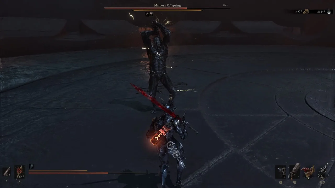 Image showing the Malborn Offspring boss winding up a heavy vertical slash as part of a combo